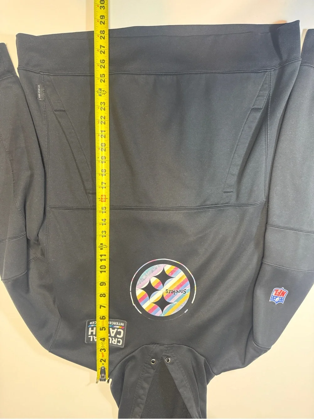 Crucial Catch Black Pullover with Multicolor Stripe Patch